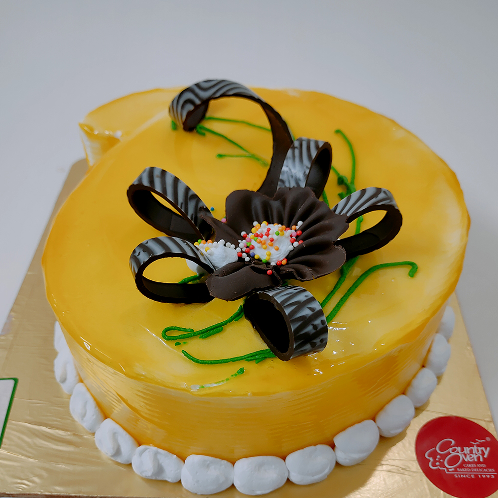 Send Joyous Mango Cake Gifts To hyderabad
